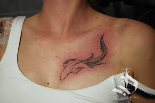 koi breast tattoo