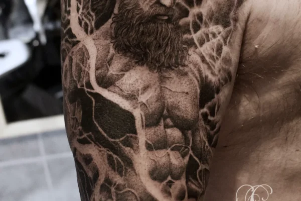 zeus upper arm tattoo